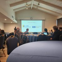 Image shows fellow attendees at a conference attended by Dr. Everett.