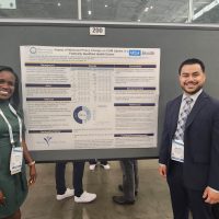 Image shows Dr. Everett and Dr. Solorzano at a conference where they gave a presentation on the Impact of Medicaid Policy Change on CGM Uptake Federally Qualified Health Center.